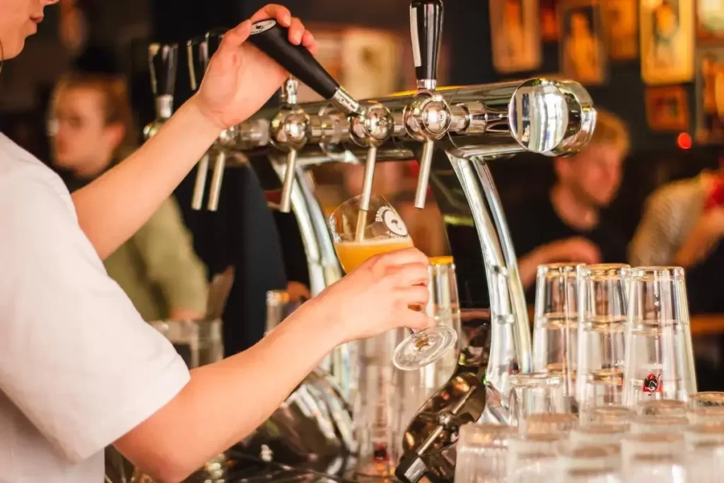 Pint being pulled at a bar